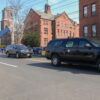 A man waves at Harris' motorcade as it passes by on Friday.